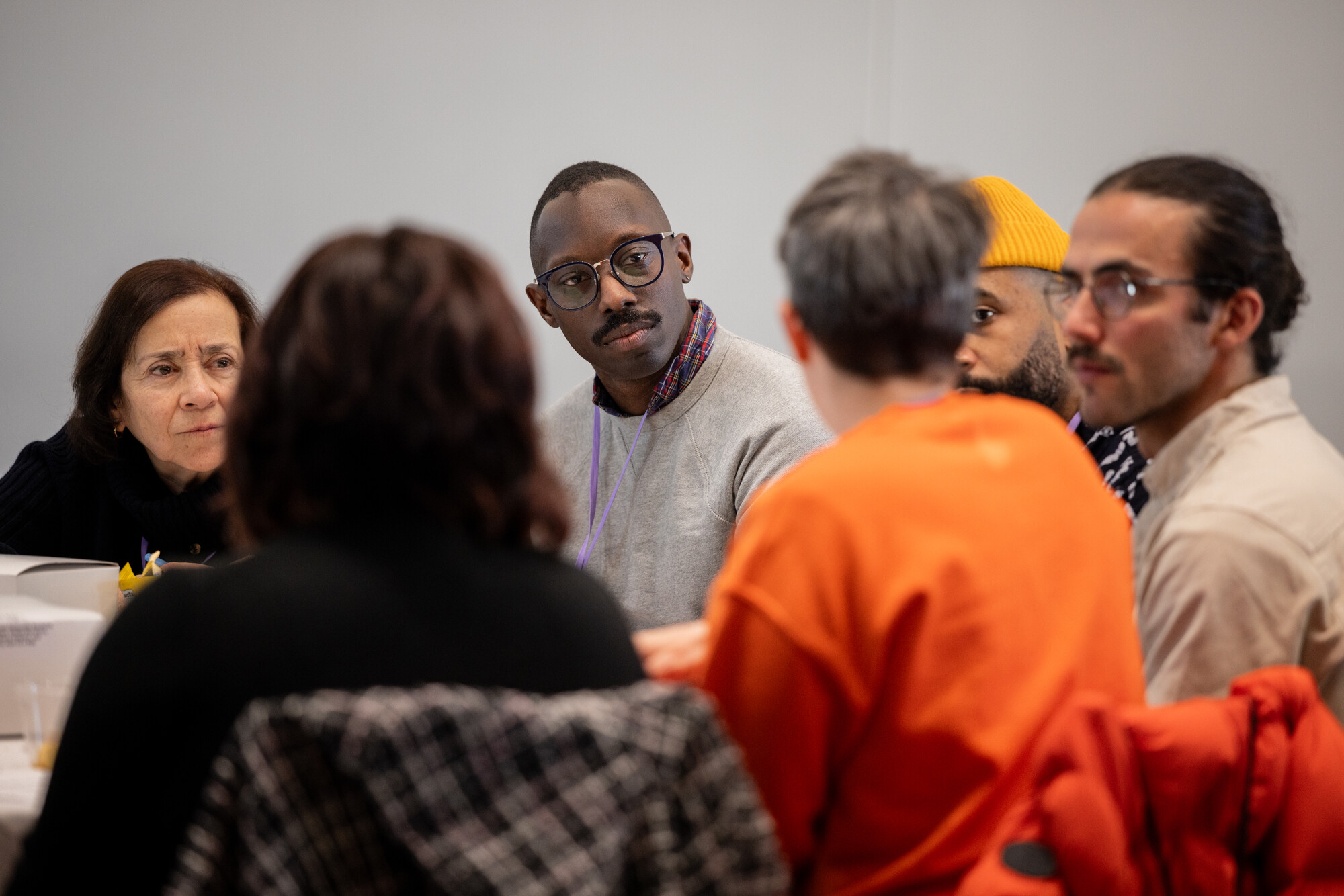 A close up shot of a small group conversation. 