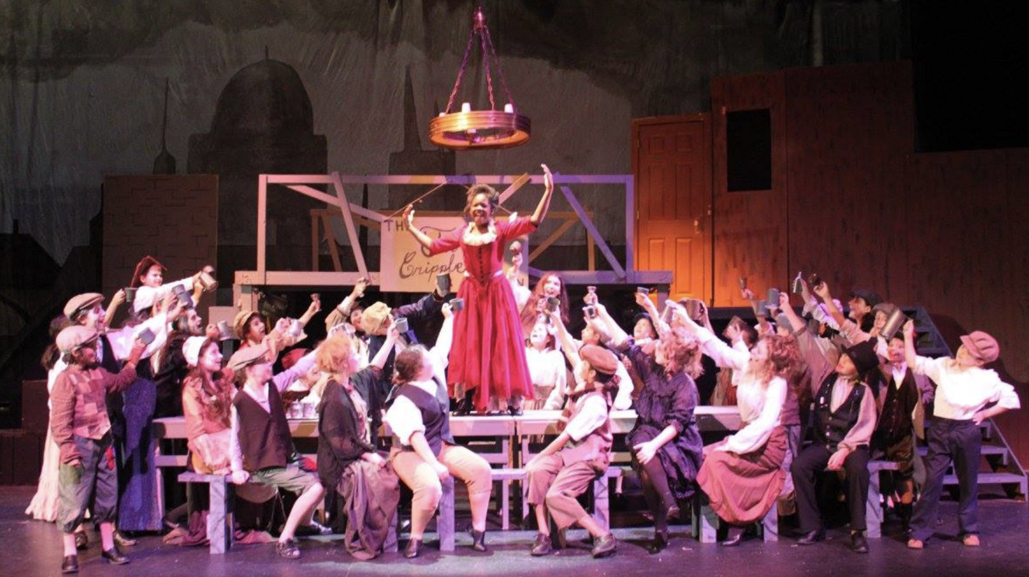 A large ensemble on stage. 