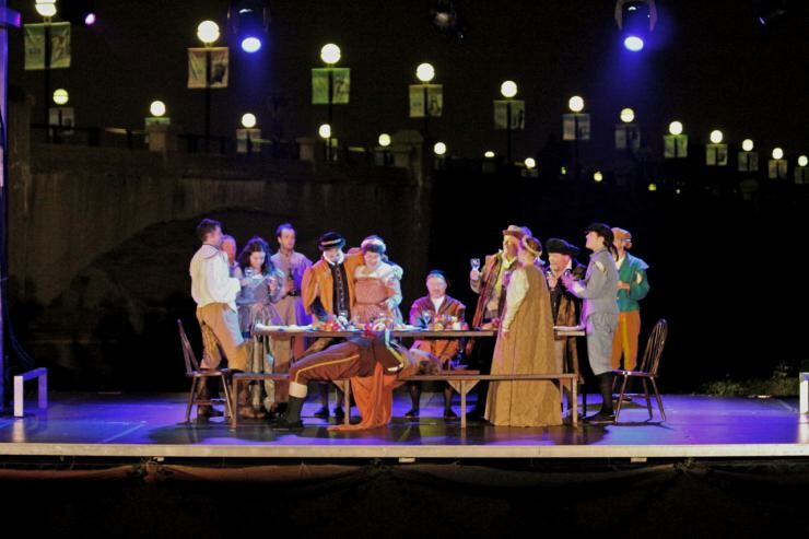 A group of people dressed in costumes on stage.