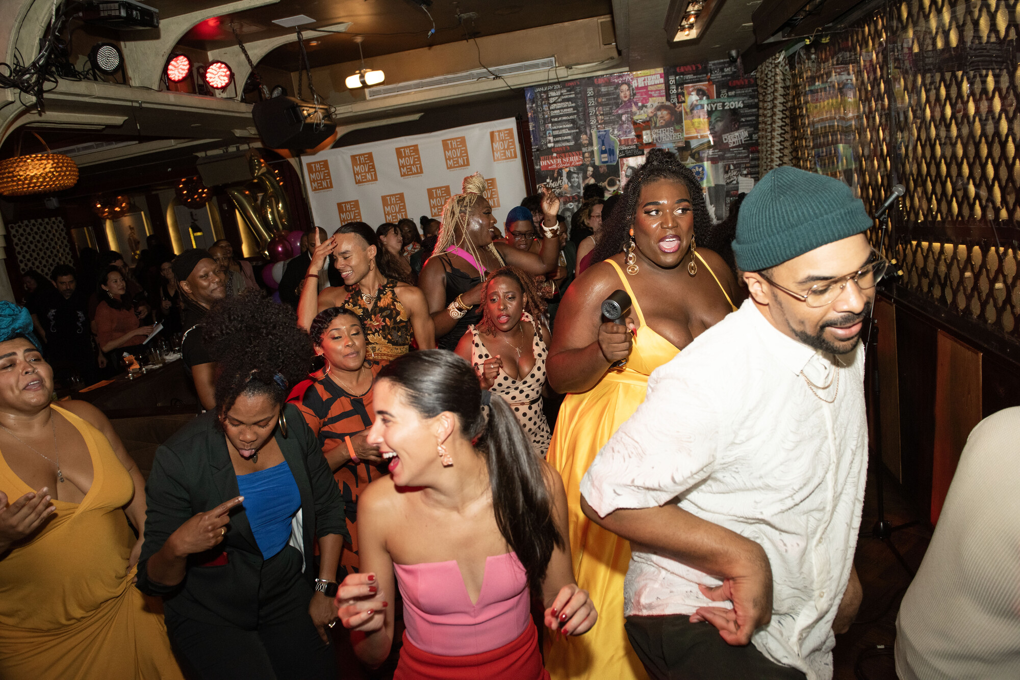 A busy party scene with lots of people dancing.