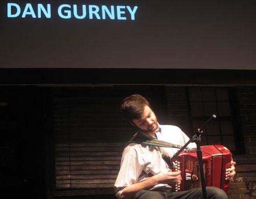 A man playing an accordion.