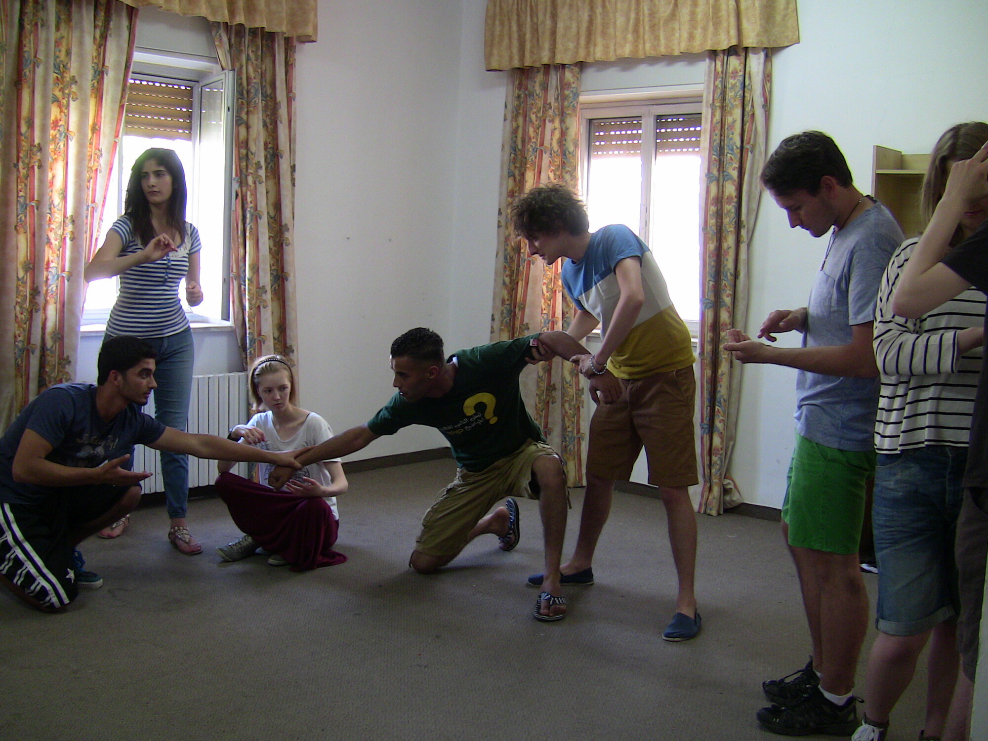 A room with people doing a physical activity.