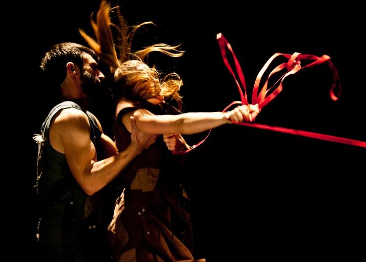 Two actors stage fighting.