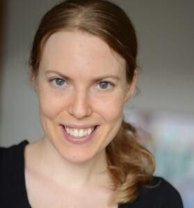 A headshot of a blonde white woman.