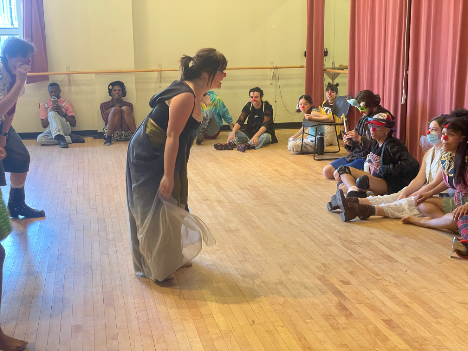 A woman leading a dance workshop.