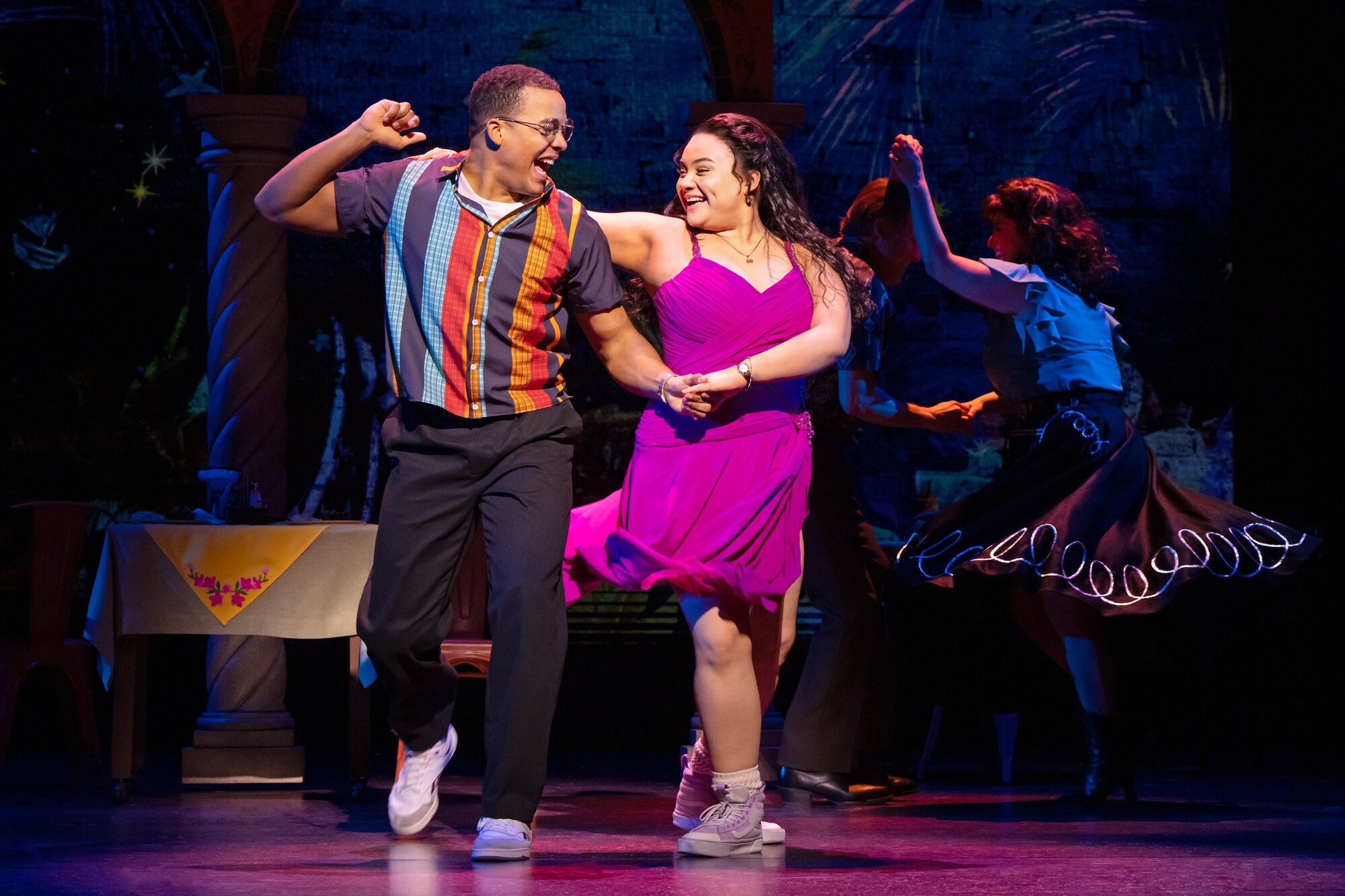 Two people dancing together on stage.