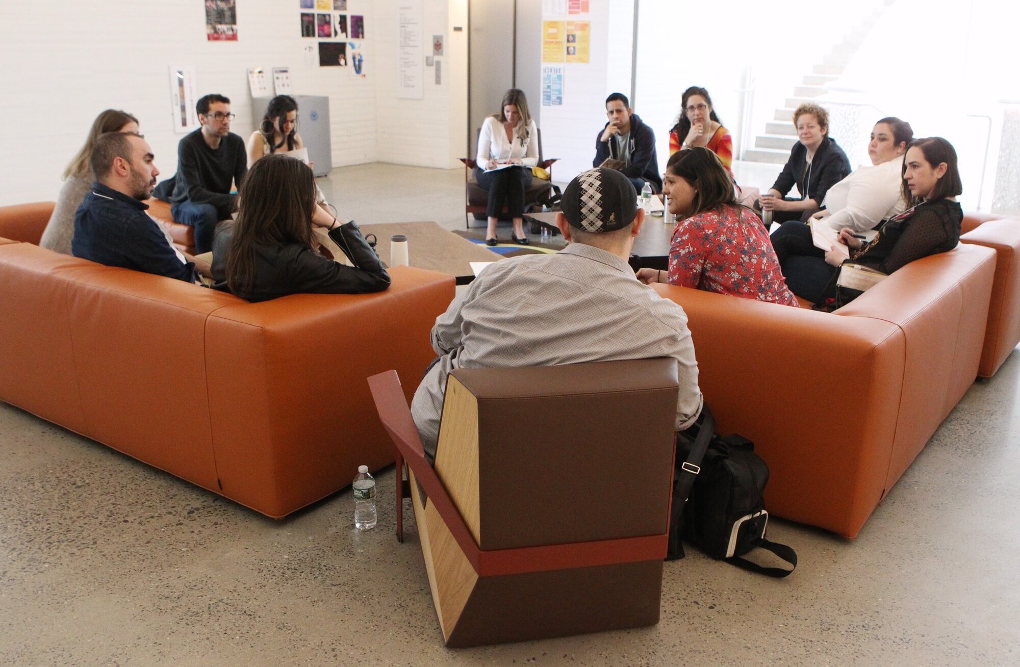 A group of people sitting on couches.