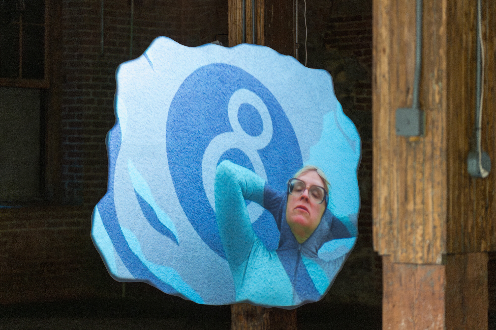 A blue blob with a person in the middle.