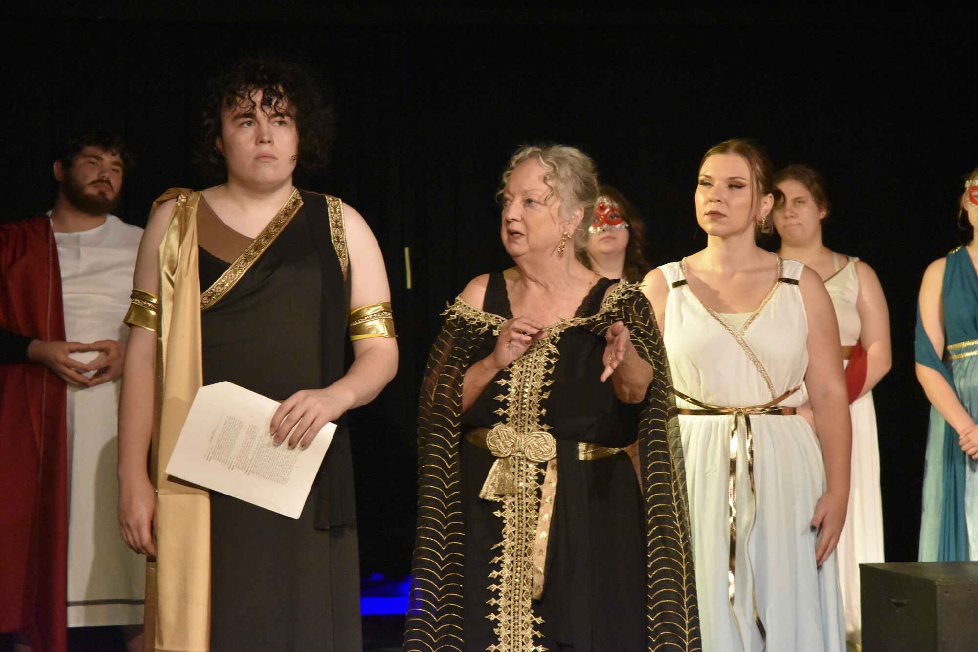 Actors dressed in greek style clothes.