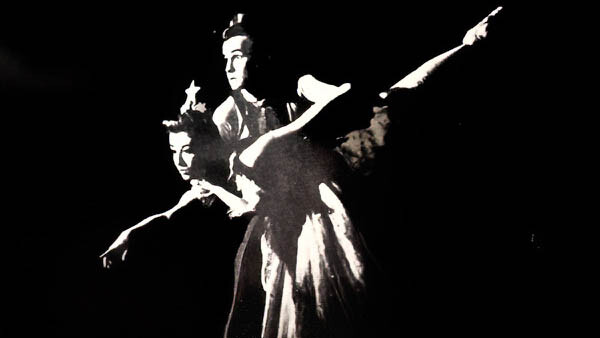 A black and white photo of two dancers.