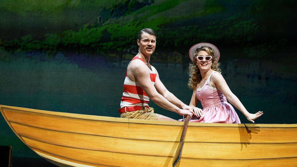 Two people in a yellow canoe.