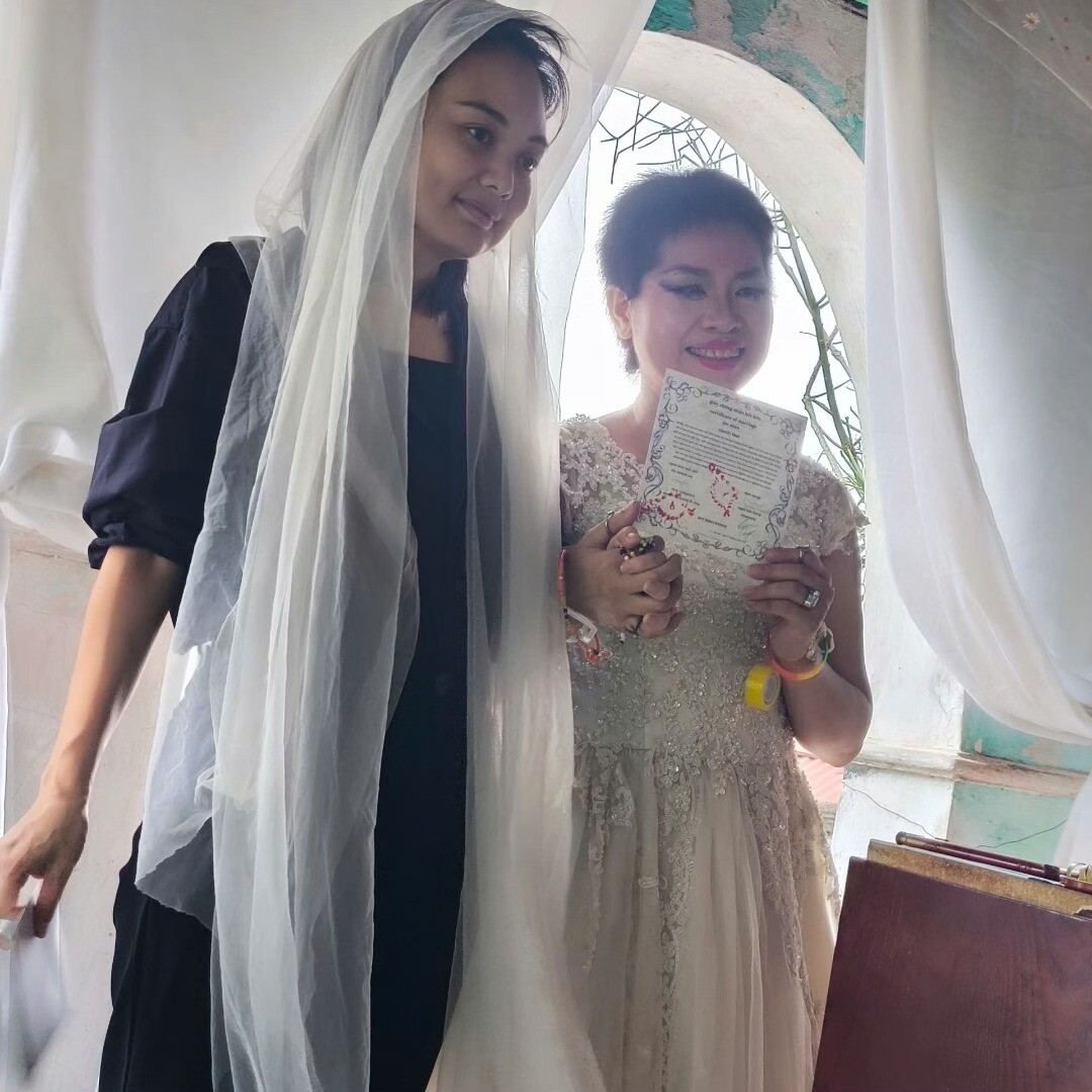 Two women getting married.