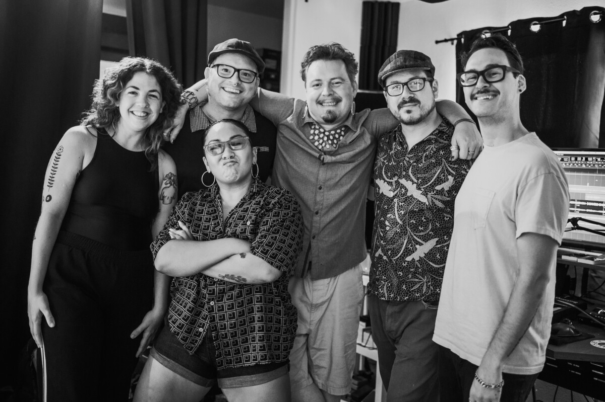A black and white photo of a group of people.