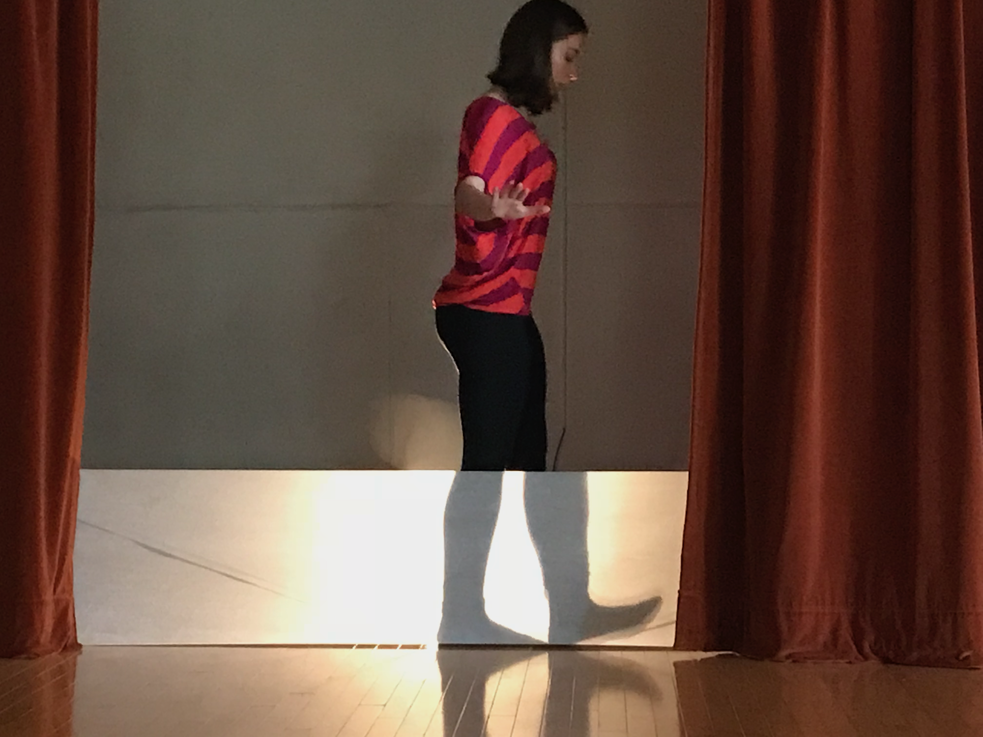 A woman walking on stage.