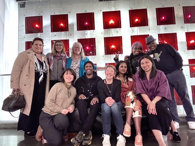 A group of people sitting together for a photo.