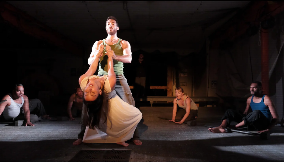 A group of people dance onstage.