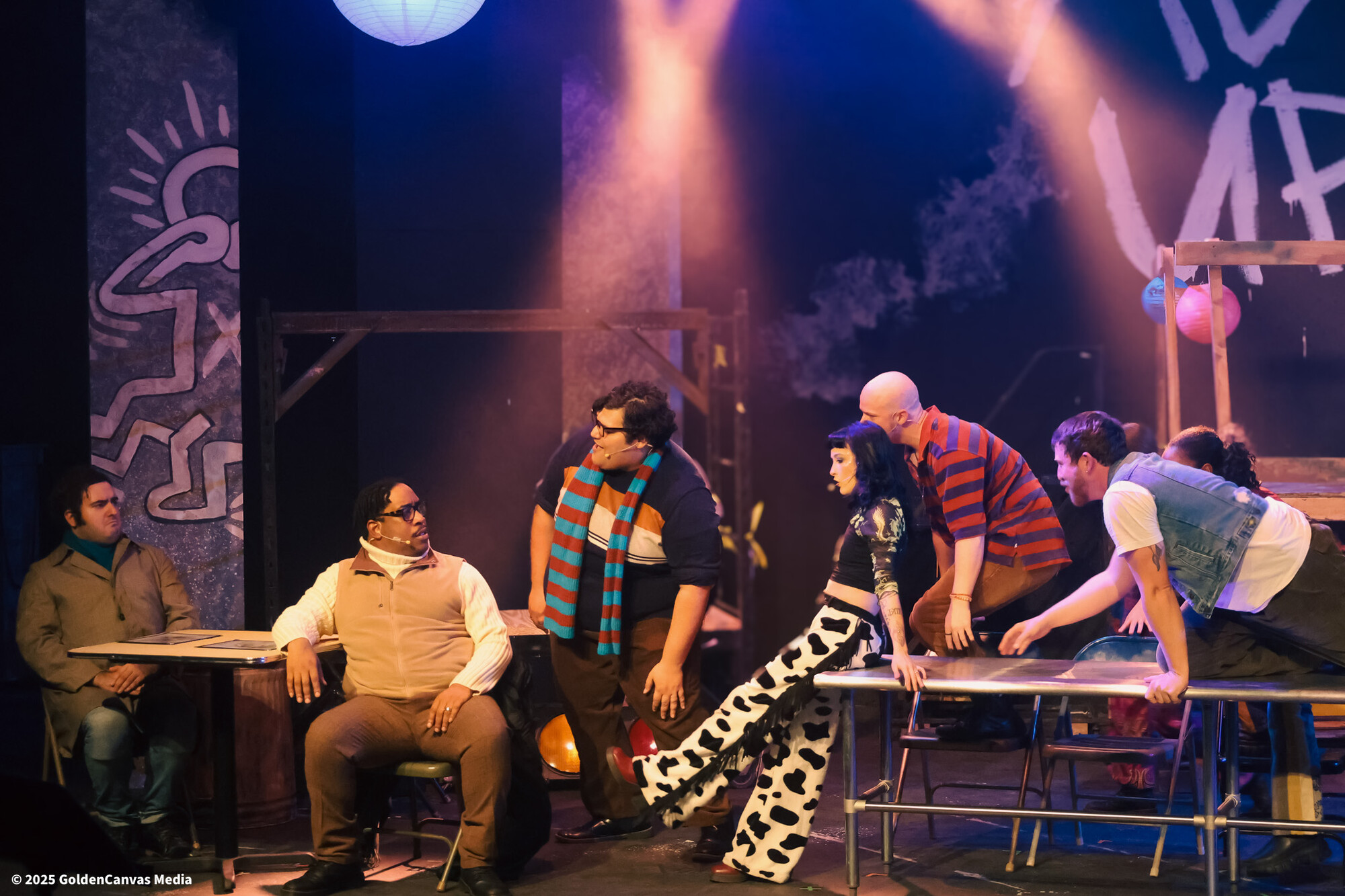 A group of people perform onstage.
