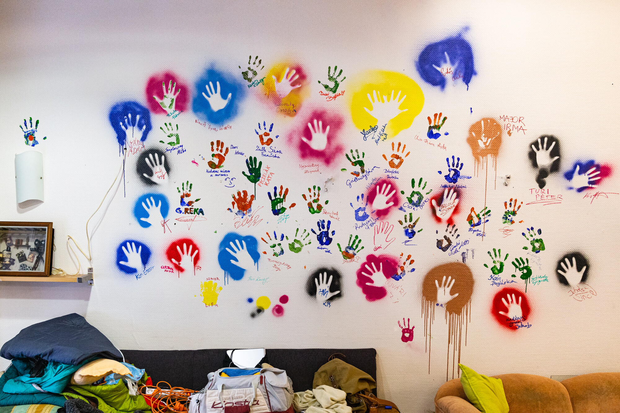 A wall mural of outlined hands.