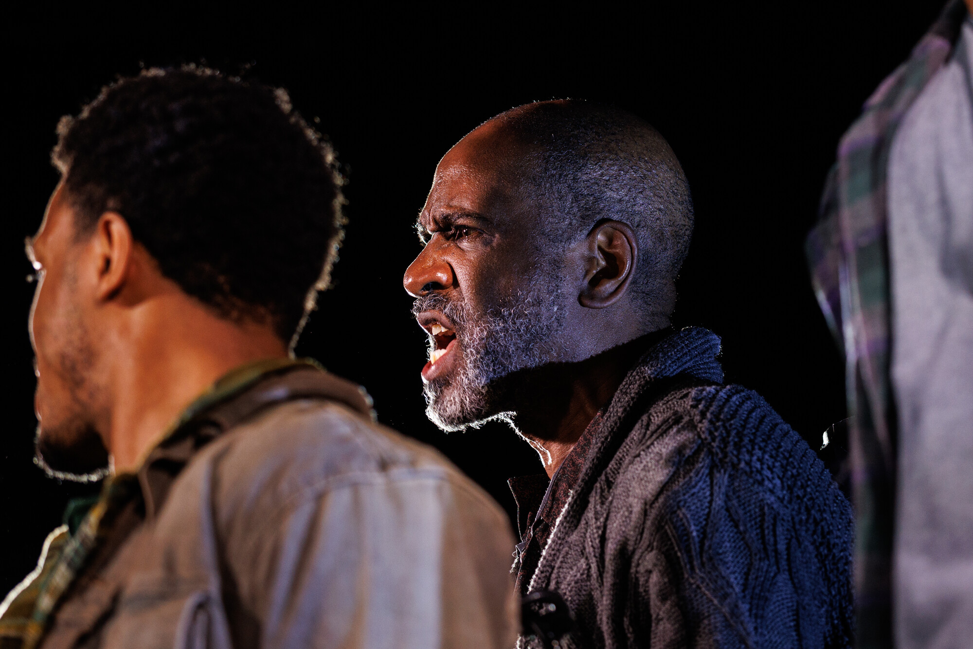 A man speaks agrily onstage.