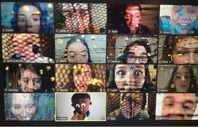 A group of faces on a Zoom screen.