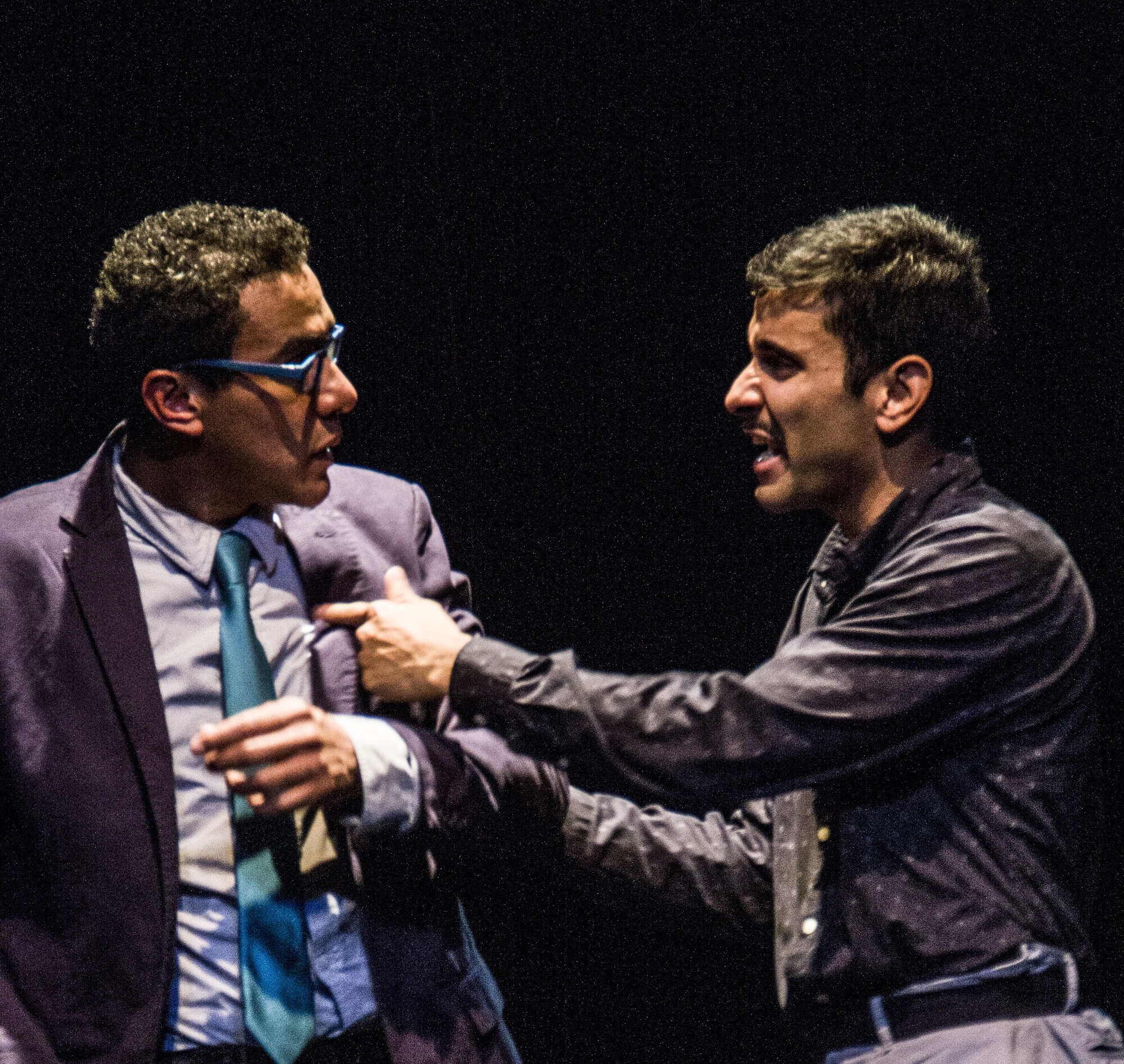 A confrontation between two actors onstage.