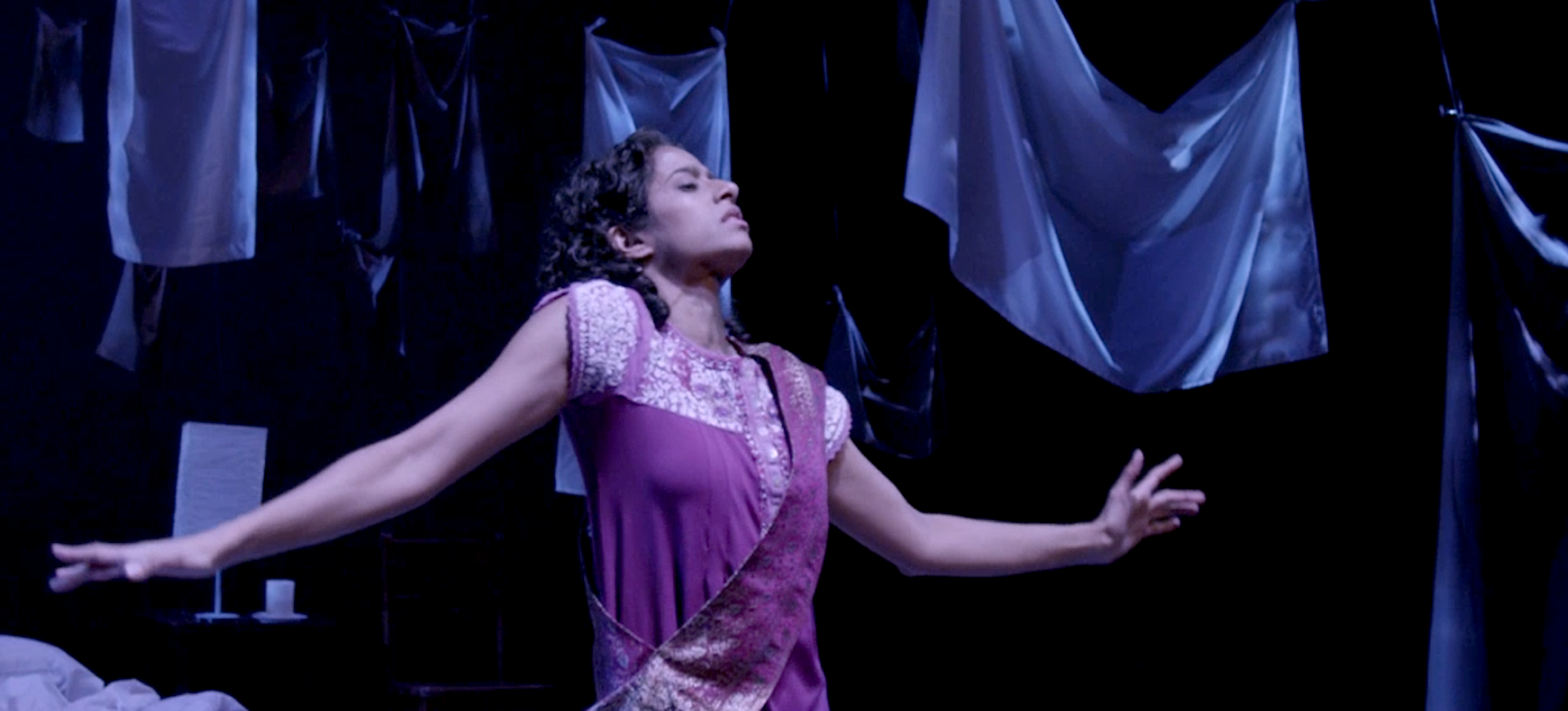 A person dances onstage.