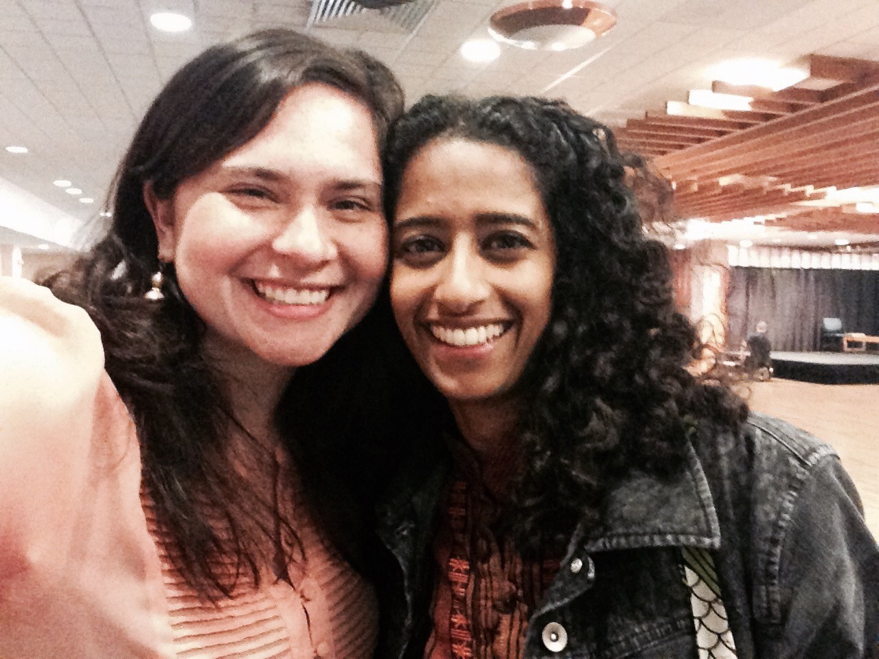 Two people smile for a selfie.