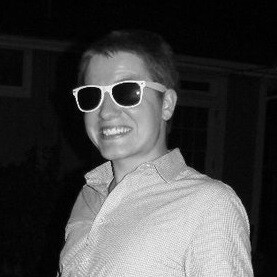 Portrait of Jeffery Bryant Moffit wearing sunglasses and smiling.