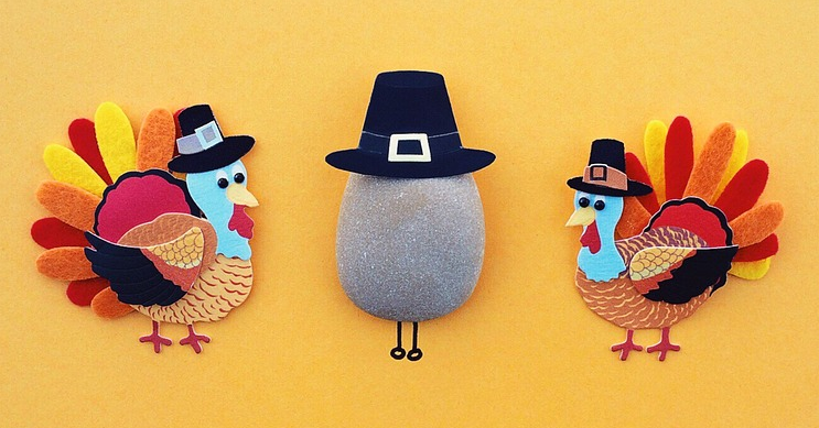 Crafted turkeys on an orange background.